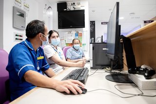 NHS staff at a desk