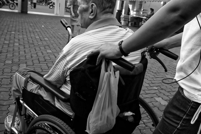 wheelchair being pushed